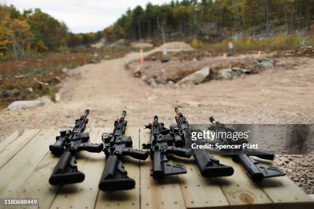 Rifles and other weapons are displayed on a table at a shooting range during the “Rod of Iron Freedom Festival” on October 12, 2019 in Greeley,...