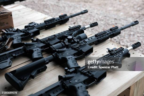 Rifles and other weapons are displayed on a table at a shooting range during the “Rod of Iron Freedom Festival” on October 12, 2019 in Greeley,...