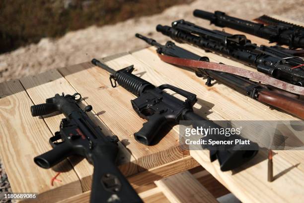 Rifles and other weapons are displayed on a table at a shooting range during the “Rod of Iron Freedom Festival” on October 12, 2019 in Greeley,...