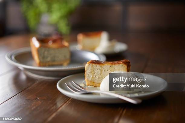 gorgonzola cheese tart cut for two. - table side view stock pictures, royalty-free photos & images