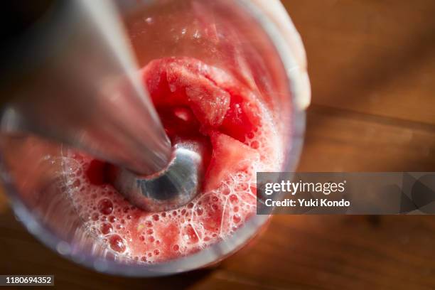 mix watermelon with a hand mixer. - action cooking fotografías e imágenes de stock