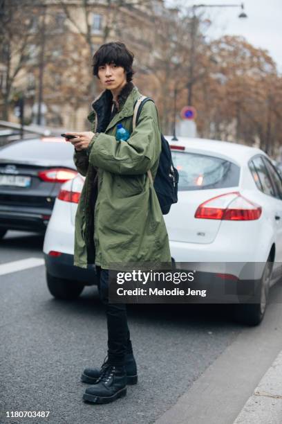 Model Na Jae Young wears a green parka coat after Heron Preston at Palais de Tokyo during Paris Fashion Week Mens Fall/Winter 2019 on January 15,...