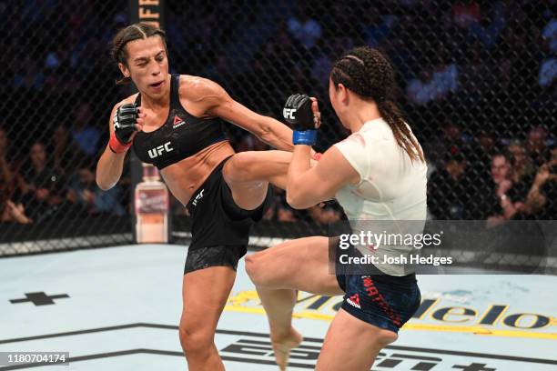 Joanna Jedrzejczyk of Poland kicks Michelle Waterson in their women's strawweight bout during the UFC Fight Night event at Amalie Arena on October...