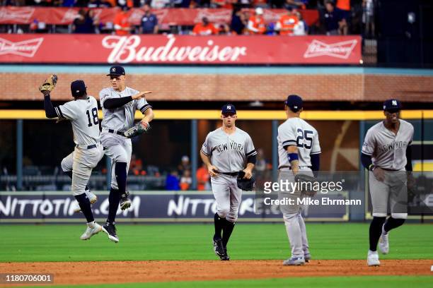 The New York Yankees celebrate their 7-0 win over the Houston Astros in game one of the American League Championship Series at Minute Maid Park on...