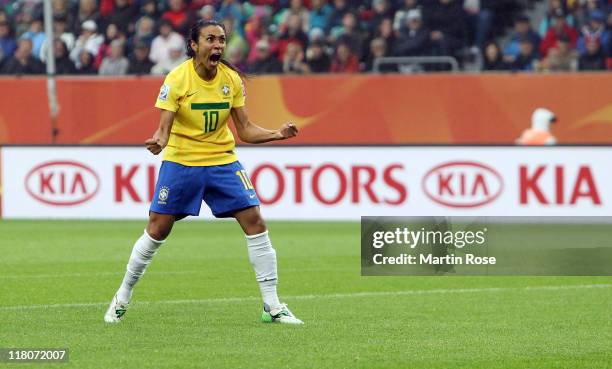 Marta of Brazil celebrates after she scores her team's openin goal during the FIFA Women's World Cup 2011 Group D match between Brazil and Norway at...