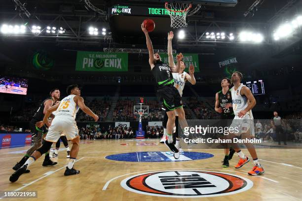 Ben Madgen of the Phoenix drives at the basket during the round two NBL match between the South East Melbourne Phoenix and the Brisbane Bullets at...