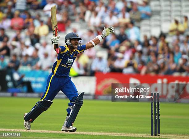 Dinesh Chandimal of Sri Lanka celebrates making a century during the 3rd Natwest One Day International Series match between England and Sri Lanka at...