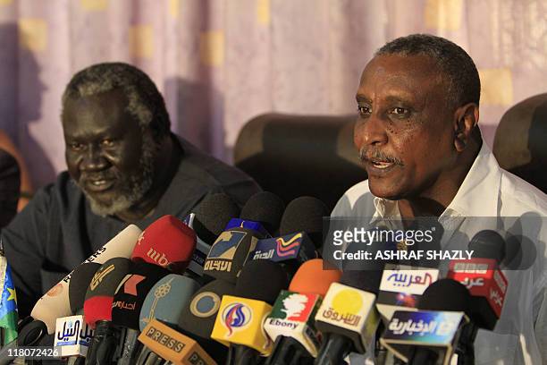 The secretary general of the northern branch of the ex-rebel Sudan People's Liberation Movement , Yasser Arman , and Malik Agar, the party's...