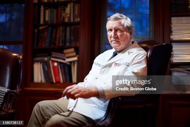 Dr. Dennis Burke, former orthopedic surgeon at Massachusetts General Hospital, poses for a portrait at his home in Milton, MA on Feb. 19, 2015. Burke...