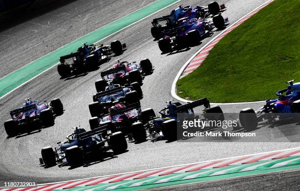 General view of the start showing Pierre Gasly of France driving the Scuderia Toro Rosso STR14 Honda leading Lance Stroll of Canada driving the...
