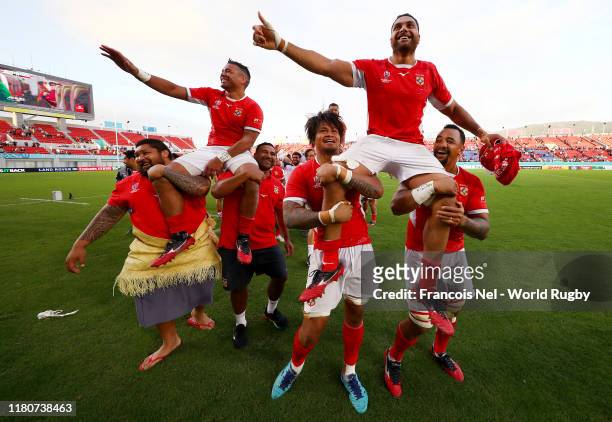 Siale Piutau and Sione Kalamafoni of Tonga are carried off the pitch following victory in the Rugby World Cup 2019 Group C game between USA and Tonga...