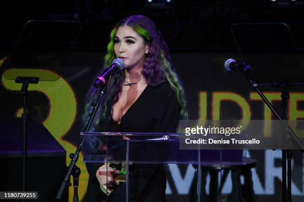 Medicated Marley presents the Spotlight award at the First Budtender Awards at Light Nightclub at Mandalay Bay Hotel and Casino on October 12, 2019...
