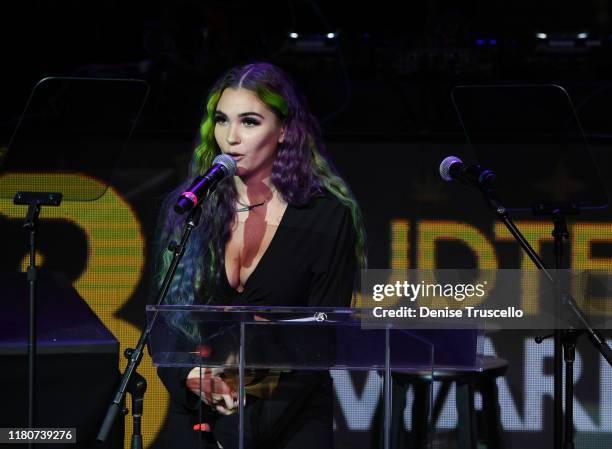 Medicated Marley presents the Spotlight award at the First Budtender Awards at Light Nightclub at Mandalay Bay Hotel and Casino on October 12, 2019...
