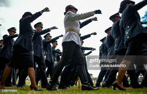 Ecuadorean women, members of the national forces, attend a parade during a graduation ceremony in Bogota, on November 7, 2019.
