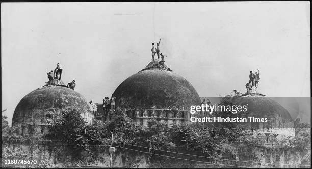 Karsevaks atop the Babri masjid shortly before it was demolished on December 6, 1992 at Ayodhya