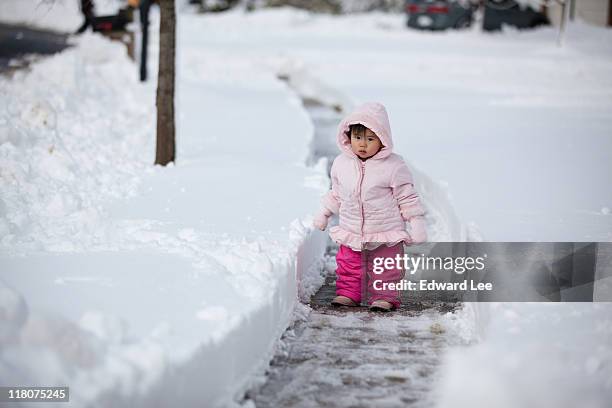 little girl in snow - germantown maryland stock pictures, royalty-free photos & images