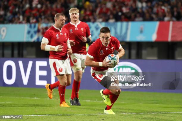 Josh Adams of Wales crosses to score his team's second try during the Rugby World Cup 2019 Group D game between Wales and Uruguay at Kumamoto Stadium...