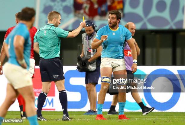 Referee Angus Gardner shows a yellow card to Santiago Civetta of Uruguay during the Rugby World Cup 2019 Group D game between Wales and Uruguay at...