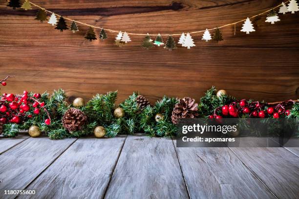 christmas lights and decoration with presents making a frame with copy space. christmas themes. - mesa imagens e fotografias de stock