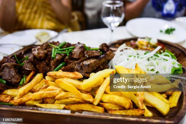 uzbek shashlik meat and fries - schaschlik stock-fotos und bilder