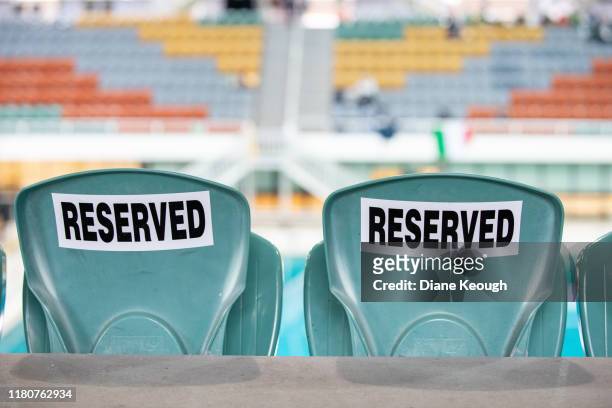 reserved plastic stadium seating. - posto riservato foto e immagini stock