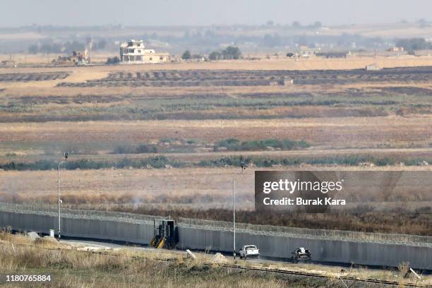 Vehicles believed to be from the Turkish-backed Free Syrian Army, a militant group active in parts of northwest Syria, patrol near the Turkey-Syria...