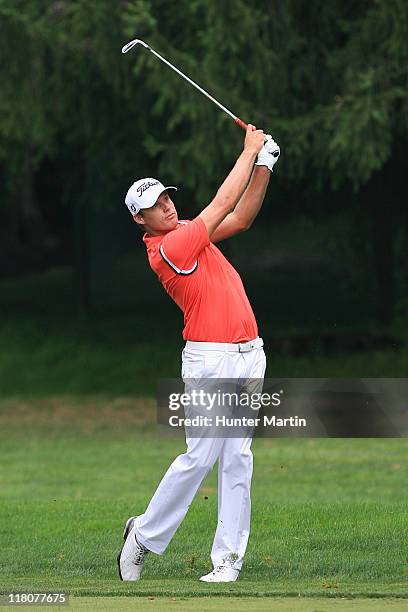 Nick Watney hits his second shot on the first hole during the final round of the AT&T National at Aronimink Golf Club on July 3, 2011 in Newtown...