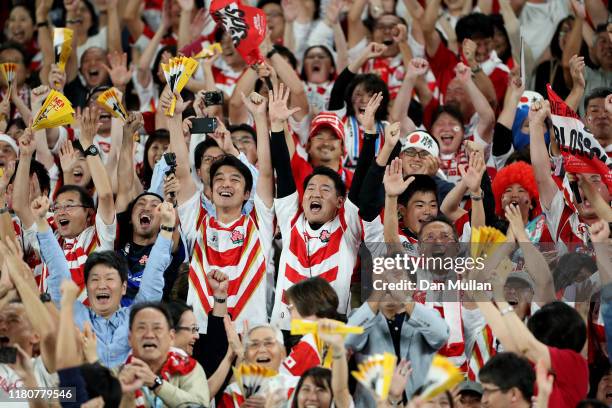Japan fans celebrate victory after the Rugby World Cup 2019 Group A game between Japan and Scotland at International Stadium Yokohama on October 13,...