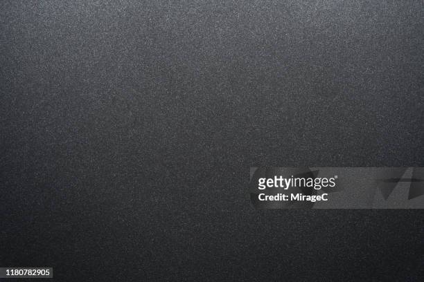 black matte coated metallic texture - zwarte kleur stockfoto's en -beelden