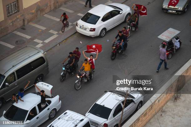 People celebrate the advance of the Turkish army and the Turkish-backed Free Syrian Army, a militant group active in parts of northwest Syria into...