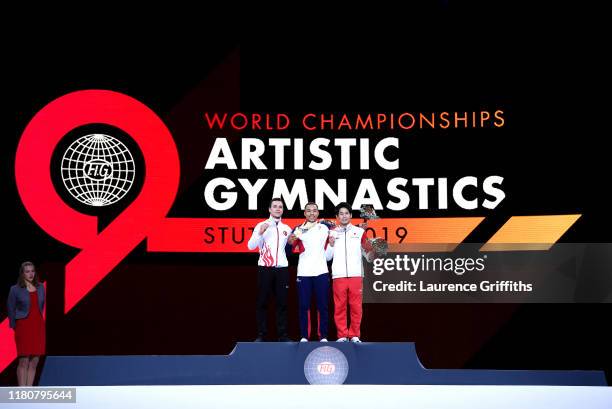 Silver medalist Ahmet Onder of Turkey, gold medalist, Joe Fraser of Great Britain and bronze medalist Kazuma Kaya of Japan stand on the podium...