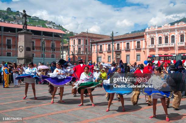 indigenous folk dancers celebrating the founding of quito - carnival in ecuador stock pictures, royalty-free photos & images