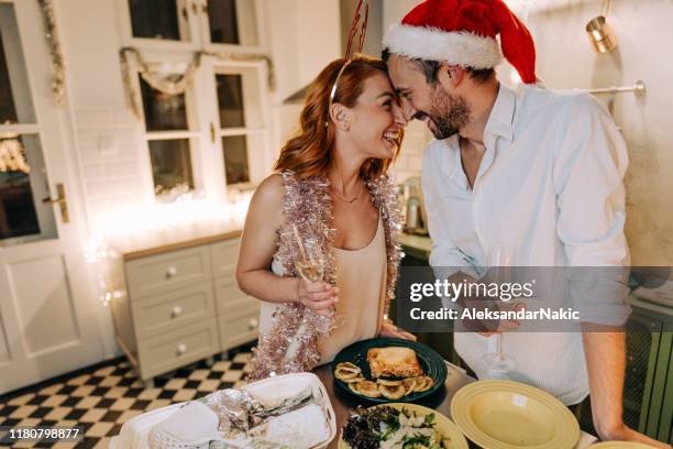 preparing dinner for new year's eve - new years eve dinner stock pictures, royalty-free photos & images