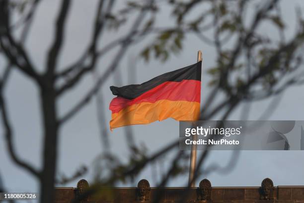 View of a German flag over the Reichstag building, the seat of the German Parliament as German Chancellor Angela Merkel meets NATO General Secretary...