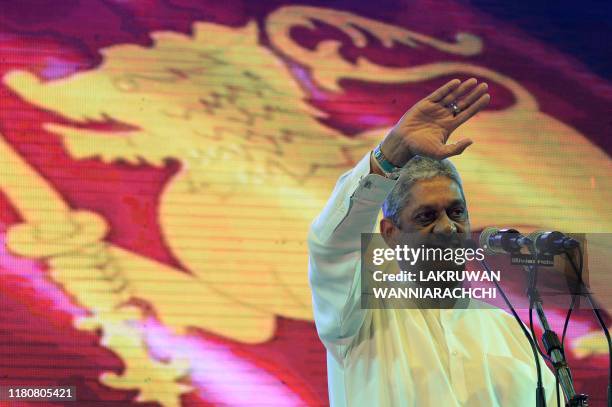 In this photo taken on November 7, 2019 former Sri Lankan army chief Sarath Fonseka waves to supporters during an election campaign rally in support...