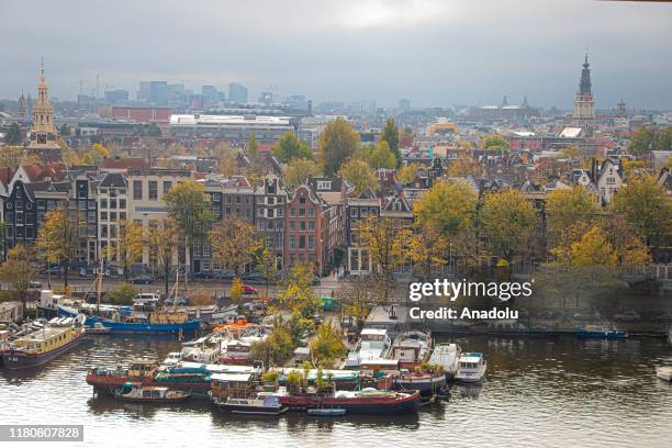 View of a river and its surroundings during autumn season in Amsterdam, Netherlands on November 07, 2019.