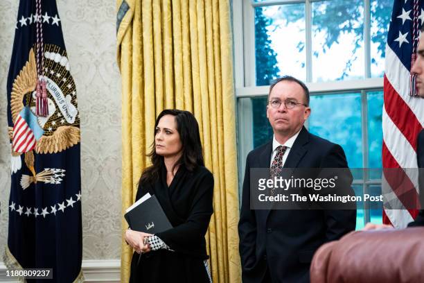 White House Press Secretary Stephanie Grisham and acting White House Chief of Staff Mick Mulvaney listens as President Donald J. Trump meets with...