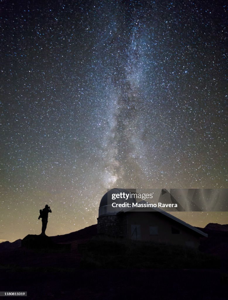 Photographer and the Milky Way.