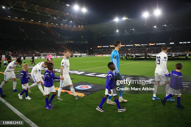 Slovan Bratislava players walk out with mascots prior to the UEFA Europa League group K match between Wolverhampton Wanderers and Slovan Bratislava...