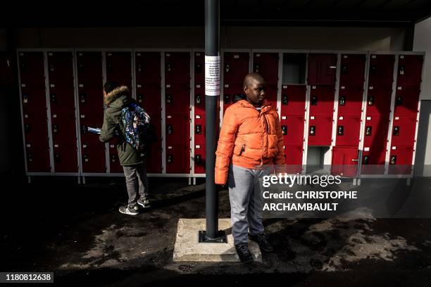 An autistic child Alioune is pictured during a break in a course delivered by a specialised teacher Caroline Berge at the College du Parc in...