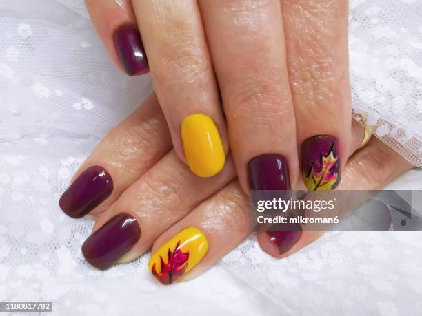 close-up of woman fingers with nail art, autumn inspired nail designs - nail art stock pictures, royalty-free photos & images