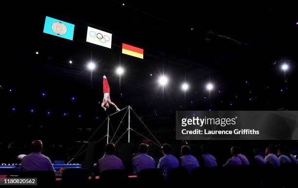 Judges watch Artur Dalaloyan of Russia compete on Horizontal Bar during the Apparatus Finals on Day 10 of the FIG Artistic Gymnastics World...