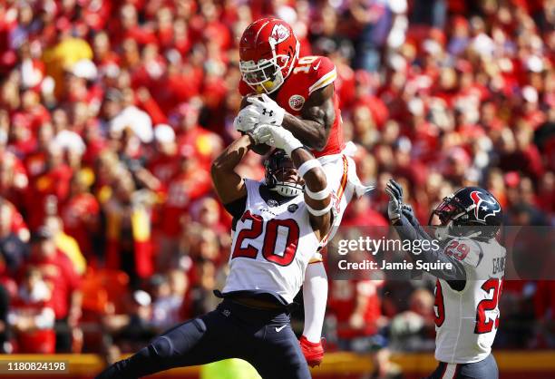 Tyreek Hill of the Kansas City Chiefs makes a 46-yard touchdown reception against Justin Reid and Phillip Gaines of the Houston Texans during the...