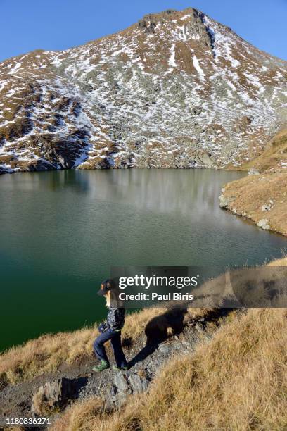 child hiking in mountains, near capre lake with iezerul caprei peak in the background, fagaras mountains - alps romania stock pictures, royalty-free photos & images