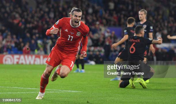 Gareth Bale of Wales celebrates scoring his team's first goal during the UEFA Euro 2020 qualifier between Wales and Croatia at Cardiff City Stadium...