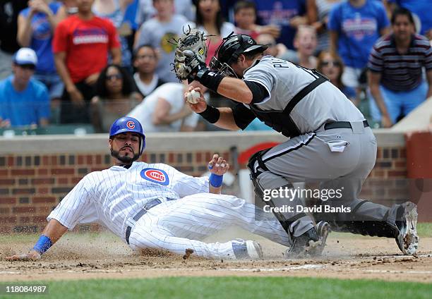 Pierzynski of the Chicago White Sox tags Geovany Soto of the Chicago Cubs out at home in the third inning on July 3, 2011 at Wrigley Field in...