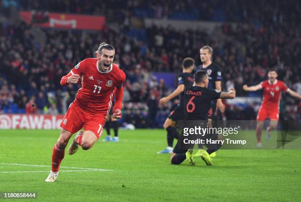 Gareth Bale of Wales celebrates scoring his team's first goal during the UEFA Euro 2020 Qualifier between Wales and Croatia at the Cardiff City...