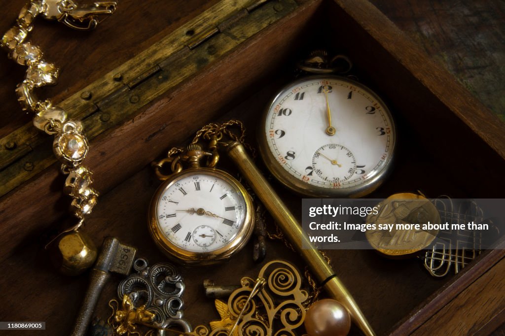 Two old pocket watches inside a box. Still life.