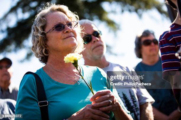 Ellen Michels, 63 years old, of Paradise, California looks on during a sneak peak of the new Building Resiliency Center, during the one year...