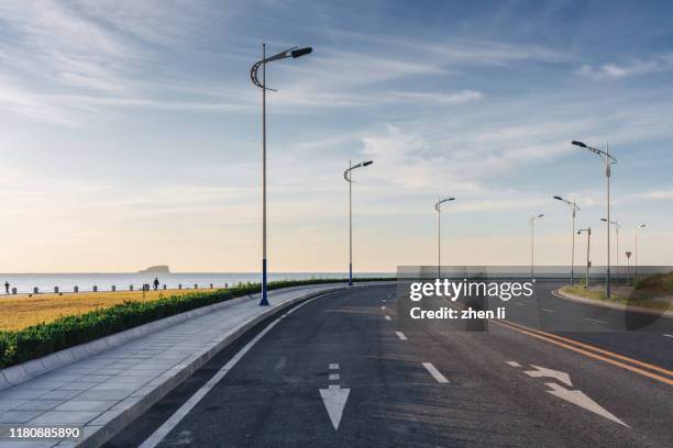 coastal highway - arrows landscapes stock pictures, royalty-free photos & images